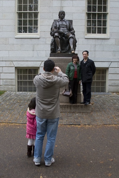 315-0595 Posing with Statue of John Harvard.jpg